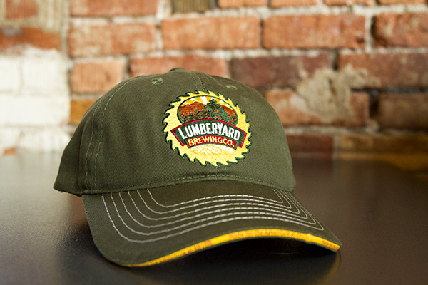Green Hat with yellow sawblade logo on front
