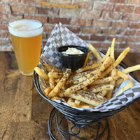 Truffle French Fries in a cone with Hazy Angel IPA